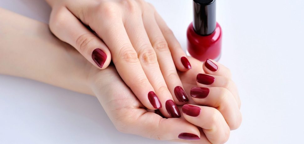 hands-of-a-woman-with-dark-red-manicure-and-nail-P5VNS4S.jpg